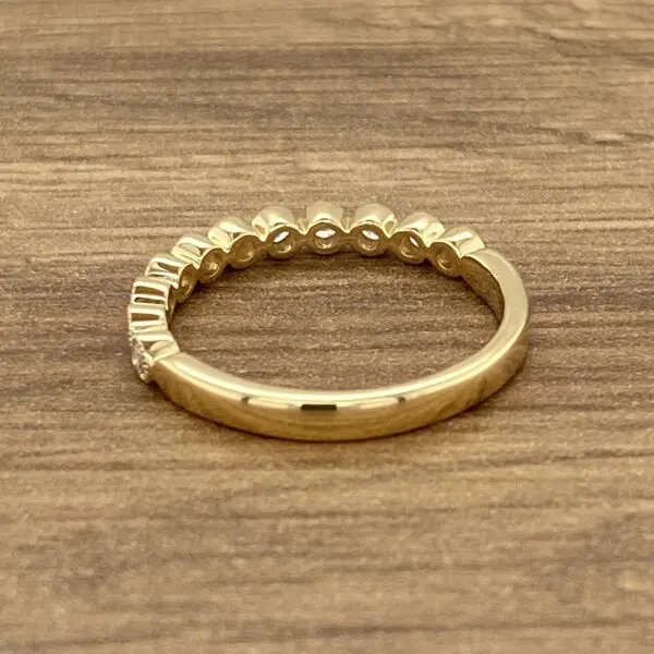 Gold band with small round diamonds.