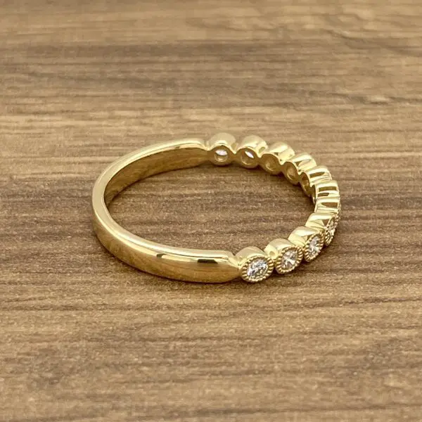 Gold band with round diamonds.