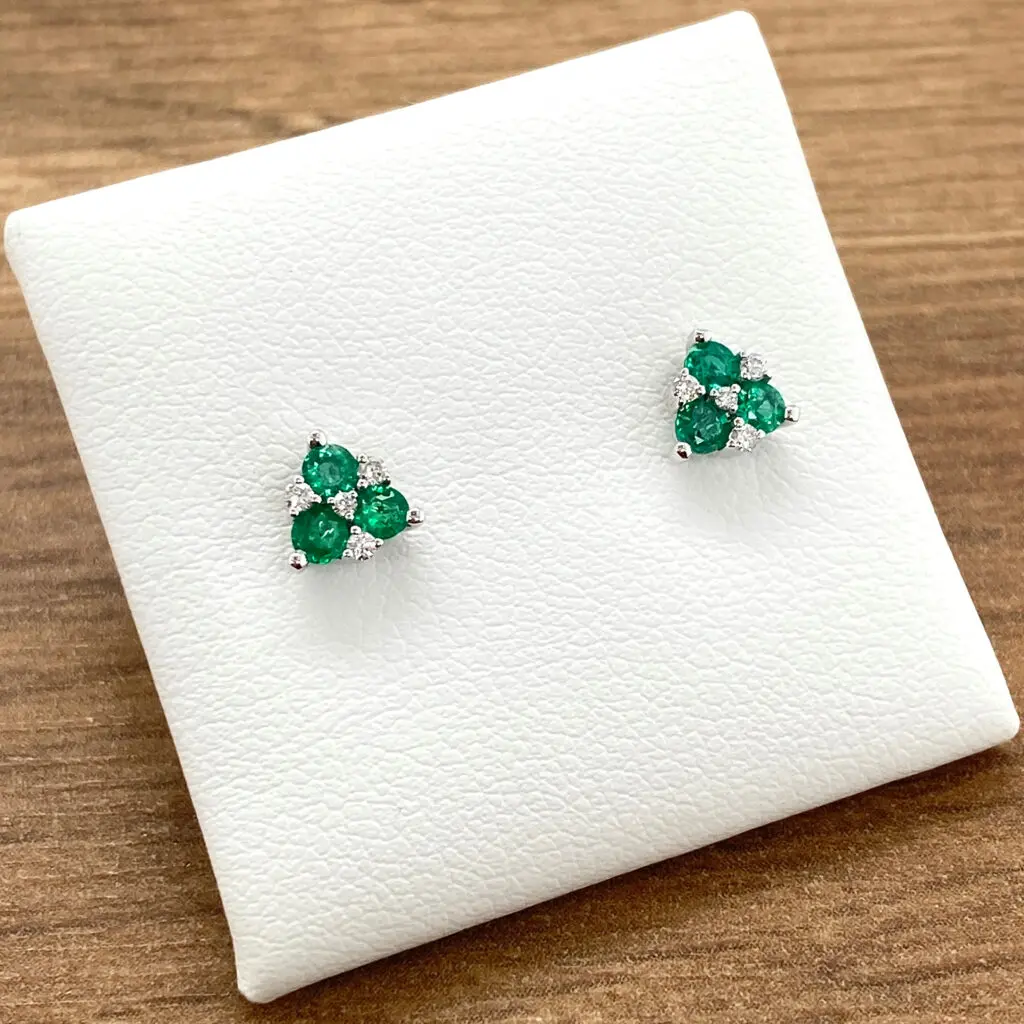 Emerald and diamond stud earrings.