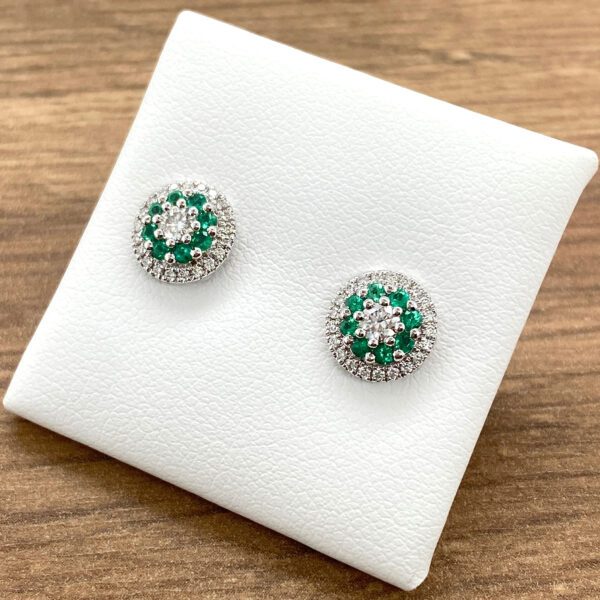 Emerald and diamond stud earrings.