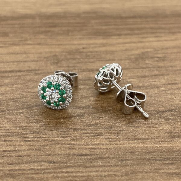 Diamond and emerald stud earrings.