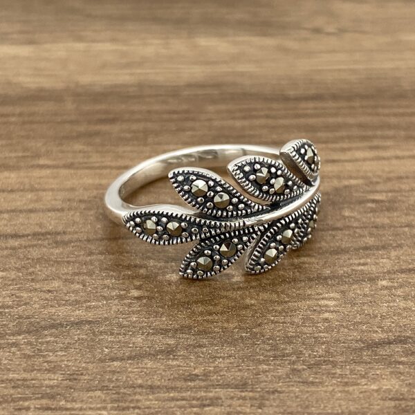 Silver ring with a leaf design set with marcasite stones.