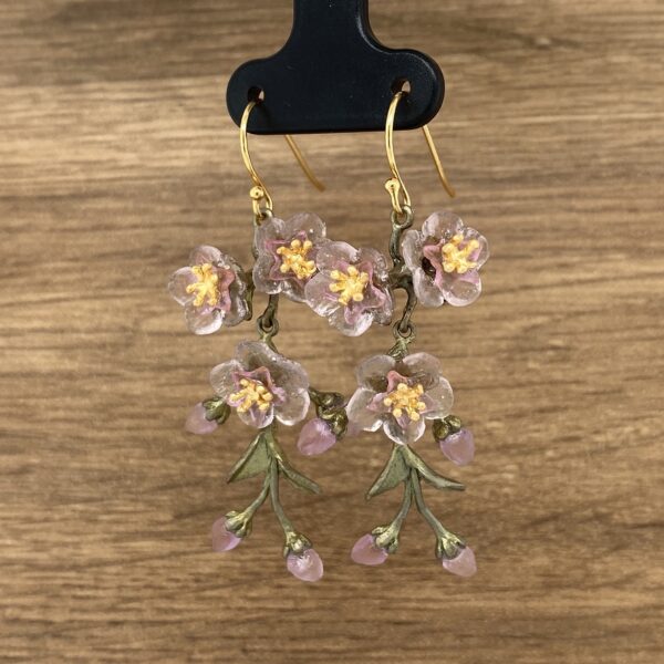 Pair of pink flower dangle earrings.