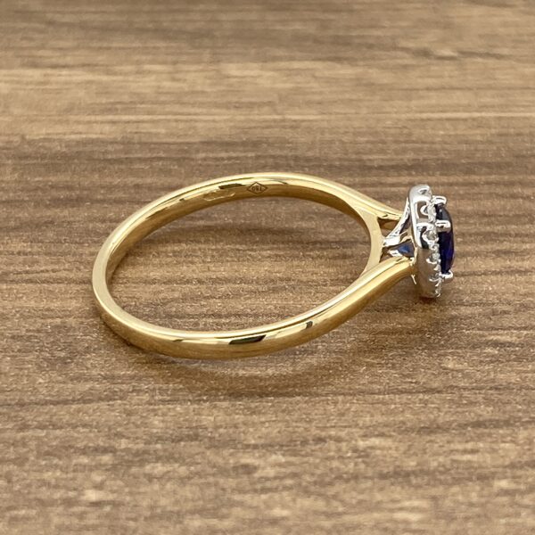 Gold ring with a blue sapphire.
