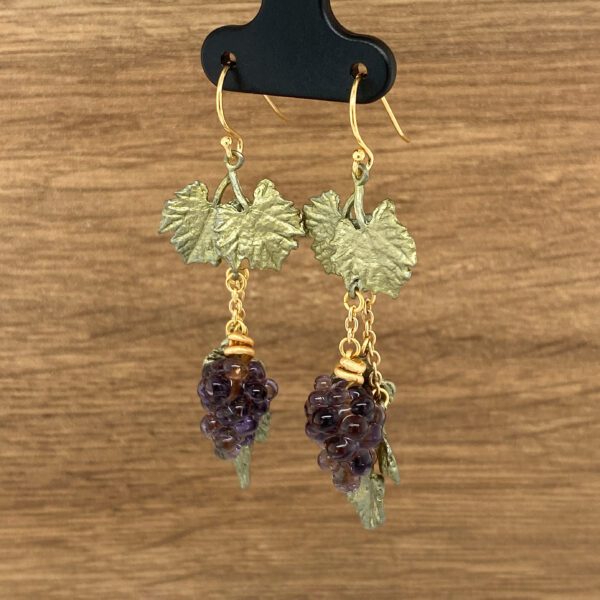 Gold grape earrings with leaf accents.