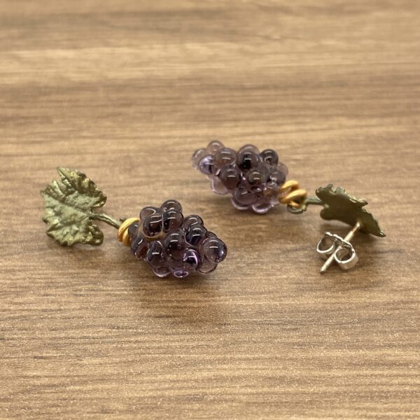 Purple glass grape earrings with leaf accents.