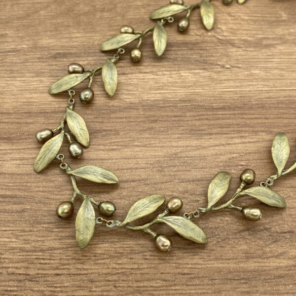 Olive branch necklace with pearls.