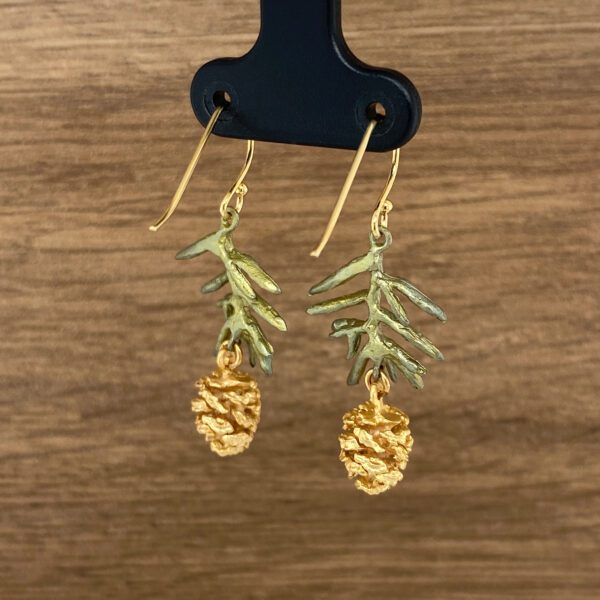 Gold pine cone and twig earrings.