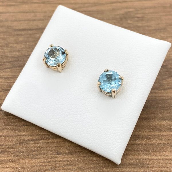 A pair of blue topaz stud earrings.