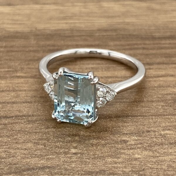 Aquamarine engagement ring with diamond accents.