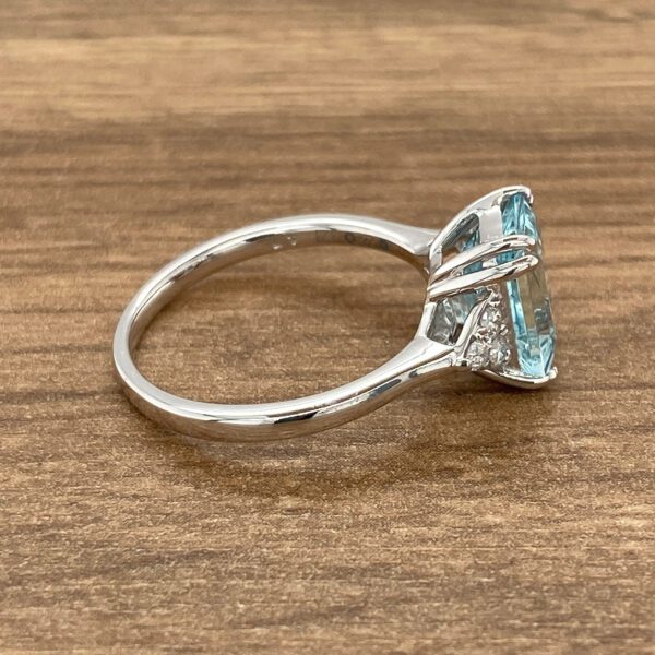 Side view of aquamarine and diamond ring.