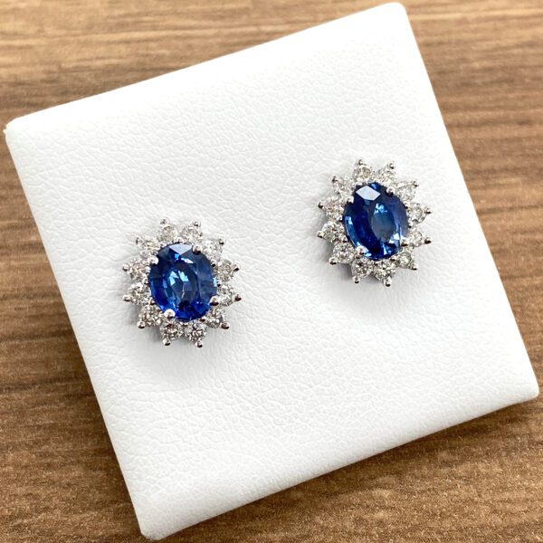 Oval sapphire and diamond earrings.