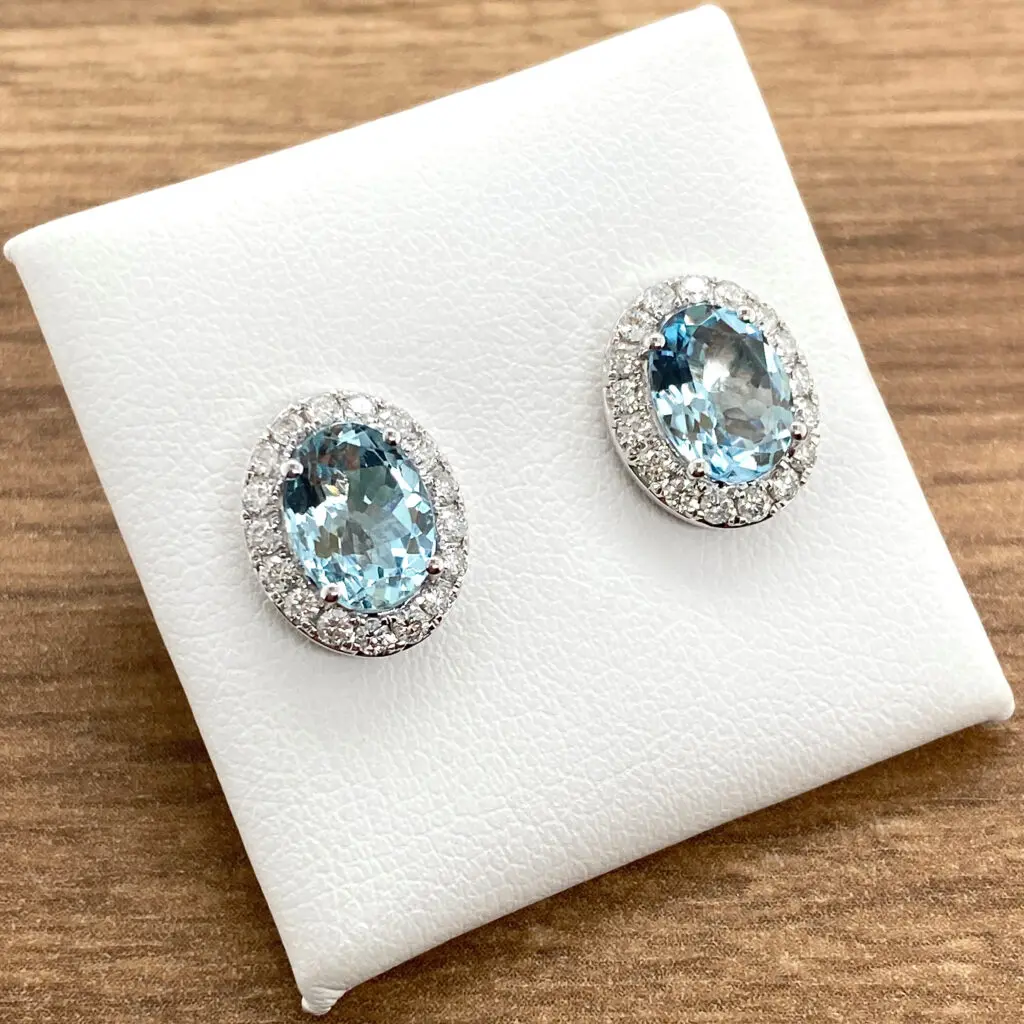 Oval aquamarine and diamond earrings.