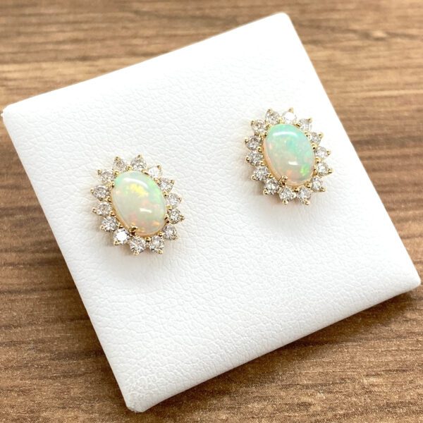 Opal and diamond halo earrings.