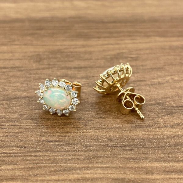 Gold opal and diamond earrings.