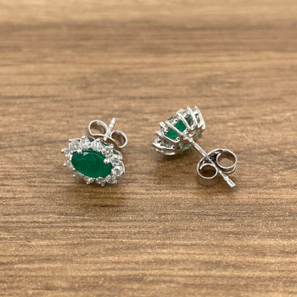 Emerald and diamond stud earrings.