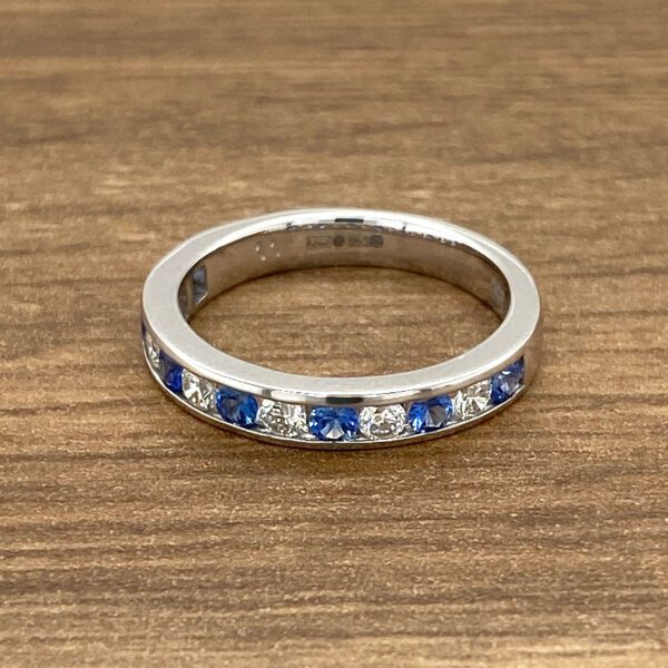 White gold sapphire and diamond band ring.