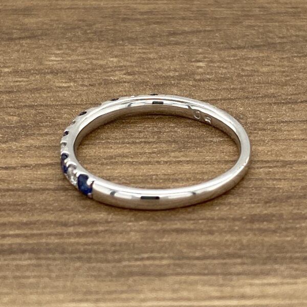 Silver band with blue gemstones.