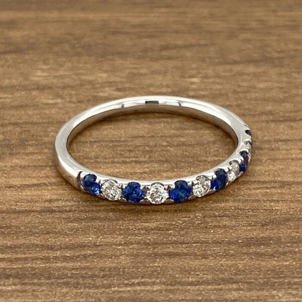 White gold band with sapphire and diamond stones.