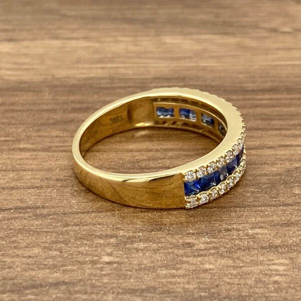 Gold band with sapphire and diamond stones.