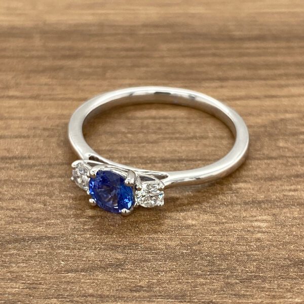 White gold ring with sapphire and diamonds.