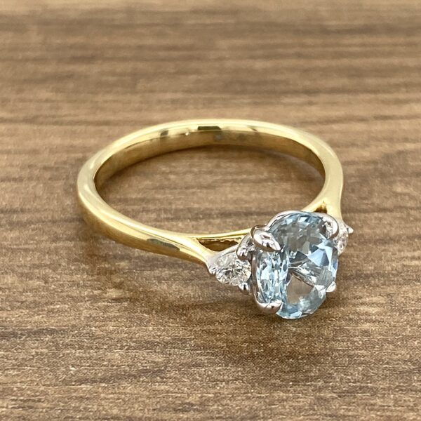 Gold ring with aquamarine and diamonds.