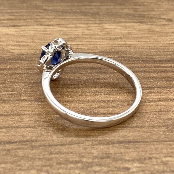 Silver ring with blue sapphire stone.