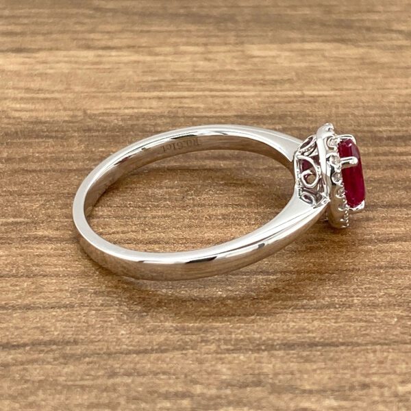 Silver ring with a red ruby gemstone.