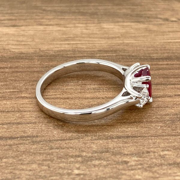 Side view of a ruby and diamond ring.