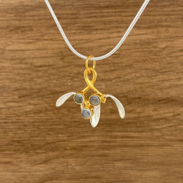 Silver and gold mistletoe pendant necklace.