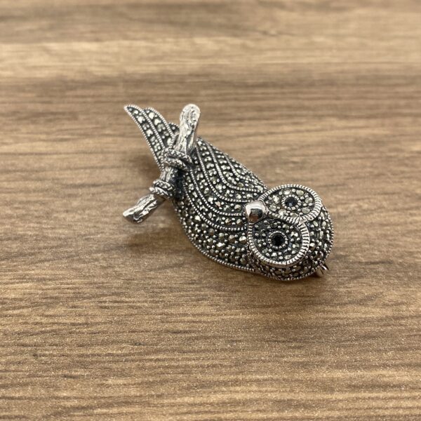 Silver owl brooch with marcasite stones.