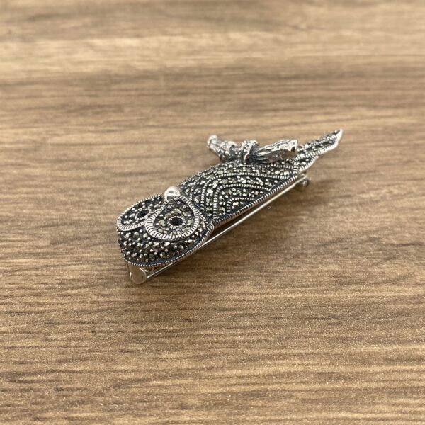 Silver owl brooch with marcasite stones.