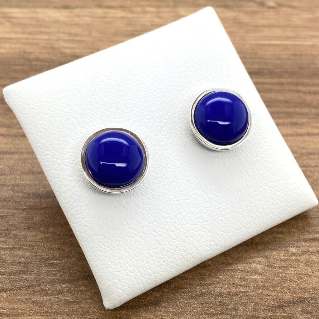 Pair of blue gemstone stud earrings.