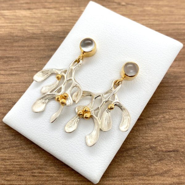 Silver mistletoe earrings with gold accents.