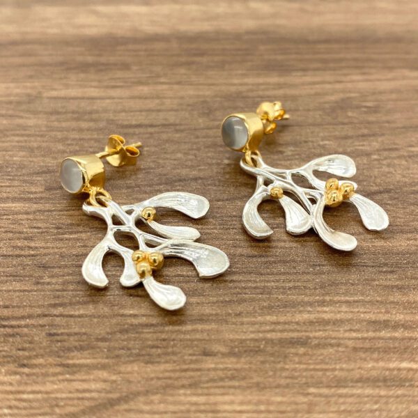 Silver mistletoe earrings with gold accents.