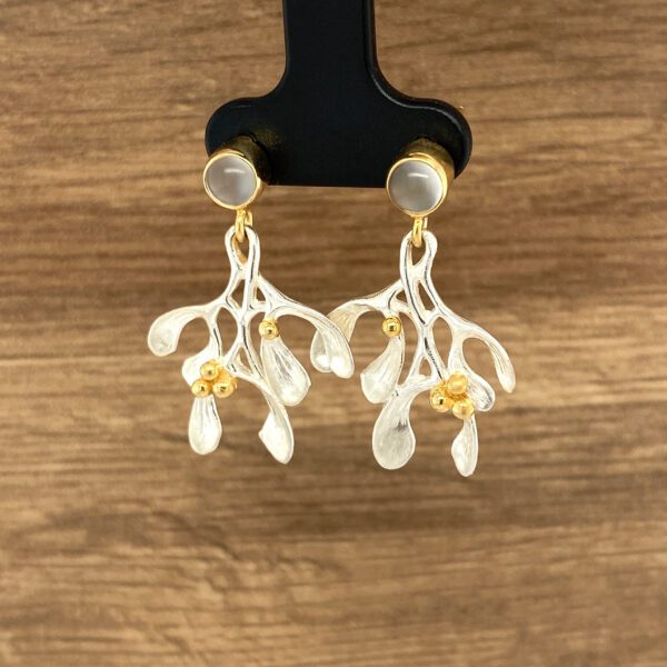 Silver mistletoe earrings with gold accents.