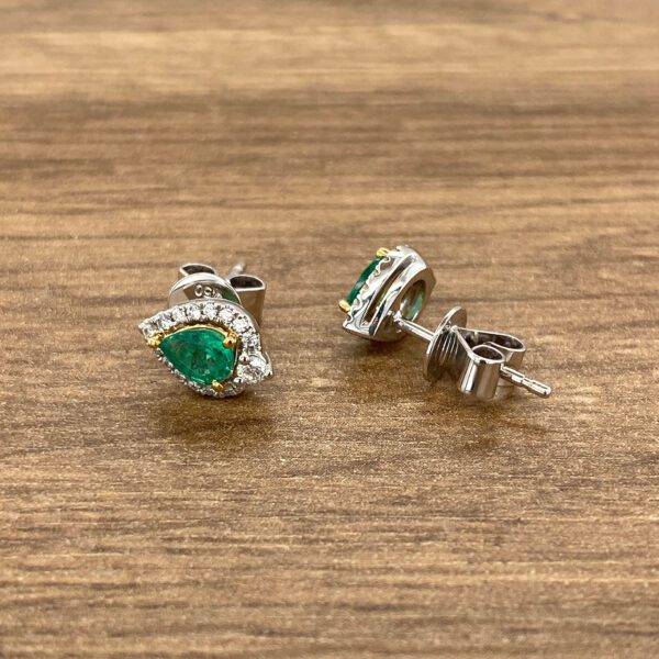 Emerald and diamond stud earrings.