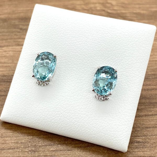 Oval aquamarine and diamond earrings.