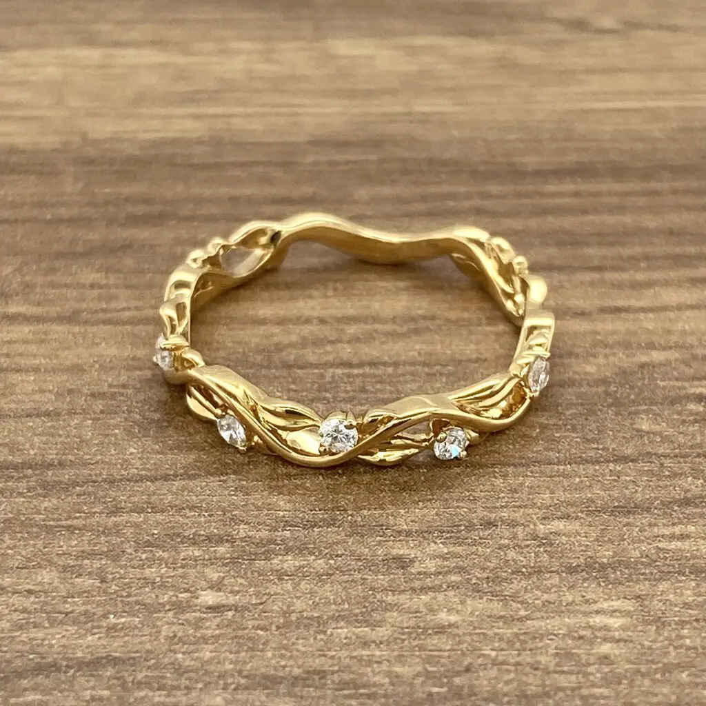 Gold band with diamond accents.