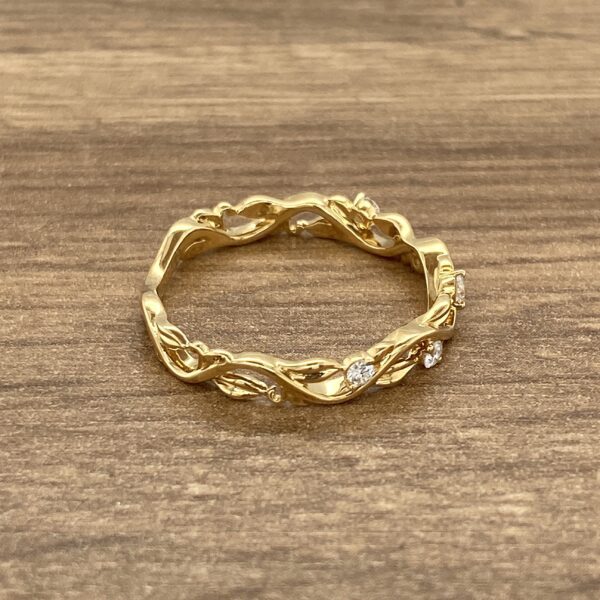 Gold vine ring with white stones.