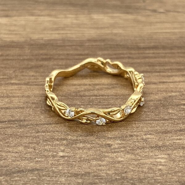 Gold vine ring with diamond accents.