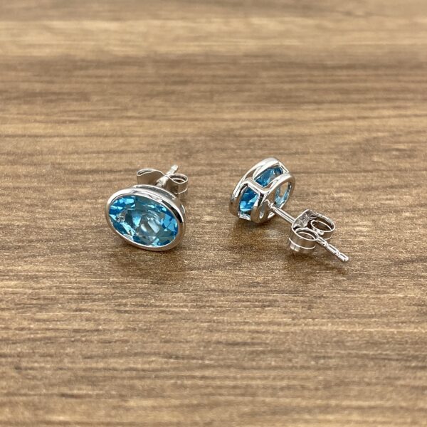 Oval blue topaz stud earrings.