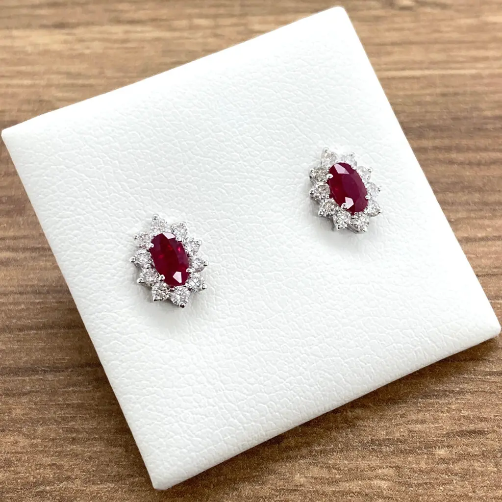 Oval ruby and diamond stud earrings.