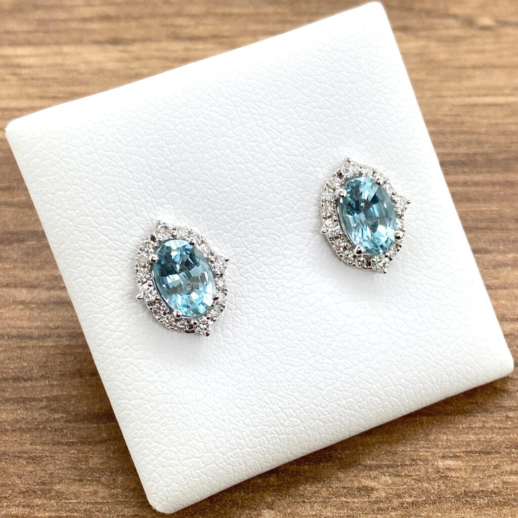 Aquamarine and diamond halo earrings.