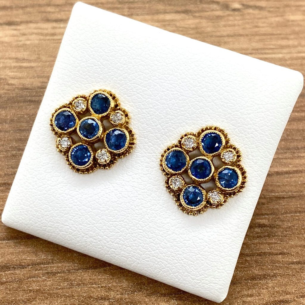 Sapphire and diamond cluster earrings.