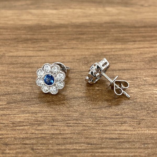 Diamond and sapphire flower earrings.