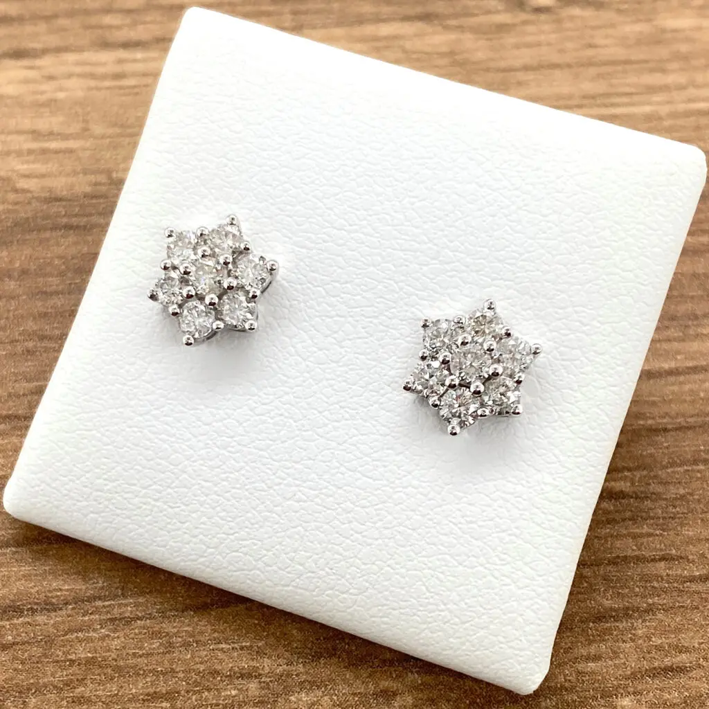 Diamond flower stud earrings pair.