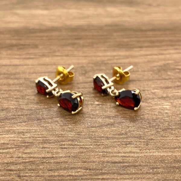 Garnet pear-shaped dangle earrings.