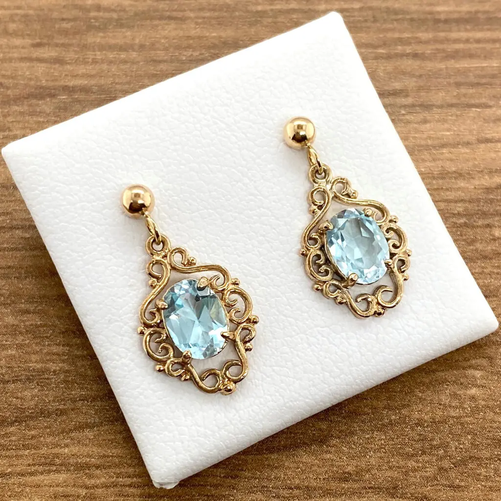 Gold aquamarine filigree drop earrings.