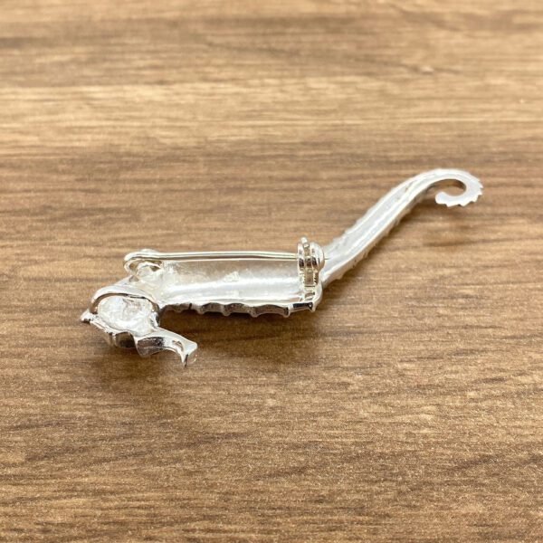 Silver seahorse brooch, back view.